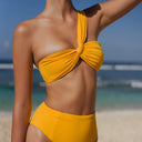 closed up Women's marigold ruched one shoulder bikini top in textured Italian swim fabric